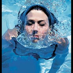 a woman swimming in the water with her head above the water's surface as if it were underwater