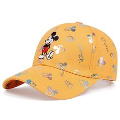 a yellow baseball cap with mickey mouse printed on the front and side, along with other disney characters