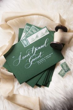 some green and white envelopes with stamps on them