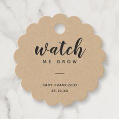 a tag that says watch me grow on it with the words baby francisco in black ink