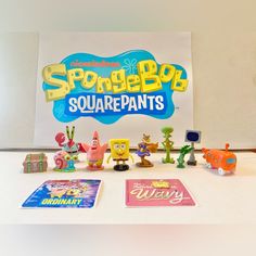 the spongebob squarepants toys are on display in front of a sign that reads spongebob squarepants