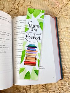 an open bookmark with the words my weekend is all booksed written on it