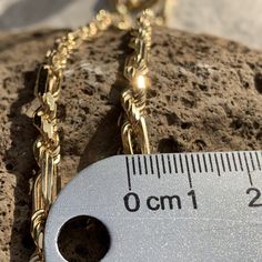 This beautiful Milano chain is strong, sturdy and stunning with a nice heavy weight. 14K Gold Plated over solid .925 Sterling Silver. The chain is finely crafted in Italy. The Milano design is a combination of long links and a rope chain style integrated together. This special includes a Hawaiian Scroll Style Fish Hook in durable and affordable gold plated over brass. Milano Chain 14K Gold plated over . 925 Sterling Silver Koa Fish Hook (2" x 1") Available in 5mm widths Elegant Rope Chain Link Bracelet, Gold Rope Chain Link Necklace, Gold Link Rope Chain Necklace, 14k Gold Oval Link Rope Chain Necklace, Koa Fish, Rope Chain, Fish Hook, Chain Styles, Solid 925 Sterling Silver