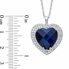 A timeless treasure, this glistening heart pendant is certain to win hers. Fashioned in sterling silver, the eye catches the 14.0mm heart-shaped lab-created blue sapphire center stone. A double border of shimmering round lab-created white sapphires wraps this center stone in a sparkling embrace. Polished to a brilliant shine, this heart suspends close to hers along an 18.0-inch box chain that secures with a spring-ring clasp. Sapphire Heart Pendant Jewelry For Anniversary, Formal Sapphire Heart Pendant Jewelry, Heart-shaped Sapphire Necklace For Formal Occasions, Heart-shaped Sapphire Necklace For Formal, Formal Heart-shaped Sapphire Jewelry, Sapphire Heart Pendant With Heart Charm, Sapphire Heart Pendant Birthstone Jewelry, Sapphire Heart Pendant For Anniversary, Fine Jewelry Sapphire Heart Pendant