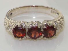 Luxury Solid 9K White Gold Natural Garnet Art Nouveau Carved Trilogy Band Anniversary Ring - Made in Formal Ruby Three-stone Rings, Anniversary Topaz Three-stone Ring, Three Stone Topaz Ring For Anniversary, Anniversary Three Stone Topaz Ring, Formal Three Stone Topaz Ring, Formal Ruby Three Stone Jewelry, Formal Three Stone Ruby Jewelry, Formal Garnet Three-stone Rings, Three Stone Garnet Jewelry For Anniversary