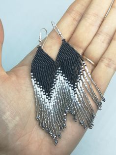 Elegant and fashionable fringe earrings. They are made in brick stitch bead weaving technique and loose fringes of qualitative Japanese Toho 15/0 glass seed beads. The size of the earrings approx. 9.5cm (3.74inch) long from the top of the earwire and 2cm(0.8inch) wide. There are used 925 sterling silver earring hooks and each earring is stamped 925. Item will be shipped carefully packed! I ship worldwide via Priority mail (Latvijas Pasts) from Latvia (EU). All orders have a tracking number and a Black And White Fringe Earrings, Silver Fringe Beaded Earrings For Gift, Silver Beaded Fringe Earrings For Gift, Silver Beaded Fringe Tassel Drop Earrings, Silver Fringe Beaded Earrings With Round Beads, Silver Beaded Earrings With Fringe And Round Beads, Handmade Gray Beaded Dangle Earrings, Silver Beaded Fringe Dangle Tassel Earrings, Silver Dangle Tassel Earrings With Beaded Fringe