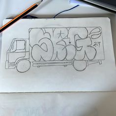 a drawing of a truck with graffiti on it and a pencil in the foreground