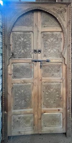 an old wooden door with intricate carvings on it