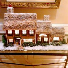 a gingerbread house with snow on the roof