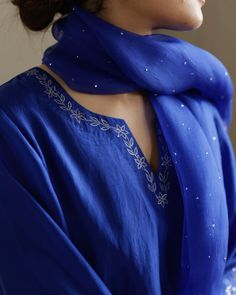 Floral embroidery detail on the neckline of this beautiful Cobalt Blue kurta set with hand done Mukaish organza dupatta. White And Blue Embroidery, Anarkali Embroidery Designs, Emrodary Work Design Kurti, Hand Embroidery On Kurta, Pent Kurti, Neck Embroidery Designs, Stylish Kurtis Design, Blue Kurta