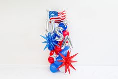 balloons and stars are arranged in the shape of letters that spell usa on a white background