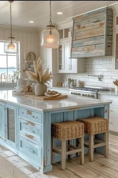 a kitchen island with two stools in front of it