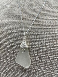 "Naturally tumbled by Lake Michigan. Frosted white beach glass . Wrapped in tarnish resistant sterling silver wire.Comes with a 22\" stainless steel necklace . Free shipping in the USA ." Seaglass Jewellery, Beach Glass Necklace, Glass Creations, Beachglass Jewelry, Glass Jewellery, White Beach, Sea Glass Jewelry, Steel Necklace, Beach Glass