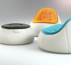 three white and blue chairs sitting next to each other on top of a white floor