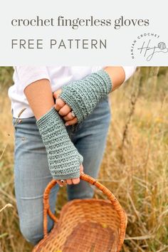 A woman wearing a white top and jeans with blue textured crochet fingerless gloves, holding a winker basket Crochet Stitches Texture, Fingerless Gloves Crochet, Mitten Pattern