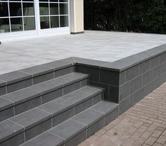 the steps are made out of concrete and brick