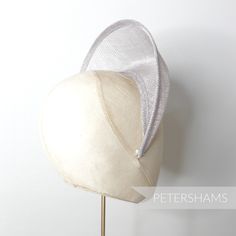 The shape of this season (and next's) has arrived! Halo crowns have stormed the millinery world and are the perfect step up from a chunky headband for a special occasion. Made from a double layer of high-quality stiffened pale grey sinamay, this shape has a domed front with a hollow underside, sinamay bias finished edges and tapered ends that sit nicely at the side of the head. You will need to fit a headband to this shape to make it functional, and our 5mm satin covered headbands do the job per Adjustable Headband Fascinator For Royal Ascot, Adjustable Fascinator With Matching Headband For Races, Adjustable Silver Headband Fascinator, Fitted Headband Bonnet For Wedding, Adjustable Headband For Church, Adjustable Mini Hat With Matching Headband For Races, Fitted Silver Headband, Adjustable Headband Headpiece For Kentucky Derby, Fitted Mini Hat Headband For Church