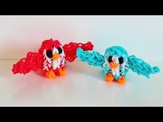 two small toy birds sitting next to each other