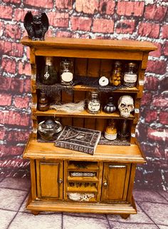 an old wooden cabinet with jars and knick - knacks