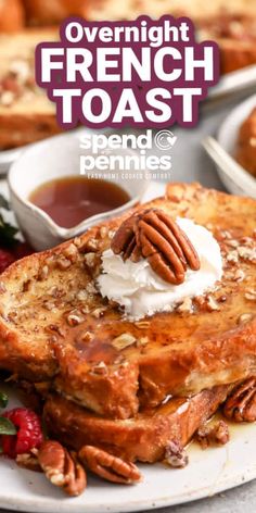 french toast with whipped cream and pecans served on a white plate next to fruit