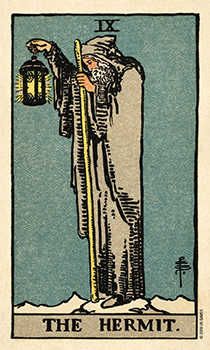 the hermit tarot card with an image of a man holding a lantern