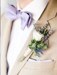 a man in a suit with a boutonniere on his lapel