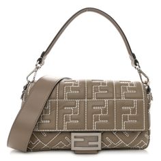 This is an authentic FENDI Nappa Stitched FF 1974 Embossed Baguette in Tortora. This bag is crafted of smooth embossed calfskin leather in beige with topstiching. This shoulder bag features a top handle, a long shoulder strap both in smooth calfskin leather and gold hardware. The front flap opens to a black fabric interior with a zipper pocket. Designer Beige Leather Baguette Bag, Designer Beige Baguette Bag, Leather Baguette Bag, Fendi Baguette, Black Fabric, Emboss, Baguette, Gold Hardware, Top Handle