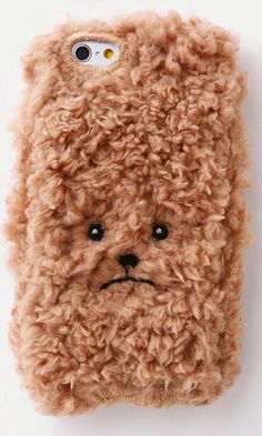 a cell phone case with a brown teddy bear face on it's back cover