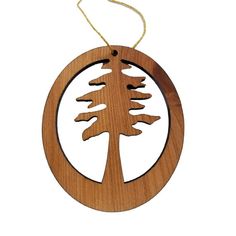 a wooden ornament with a pine tree in the center on a white background