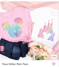 two t - shirts that are on top of each other next to flowers and a bouquet