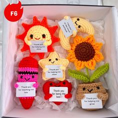 crocheted toys in a box with thank you note attached to the top one