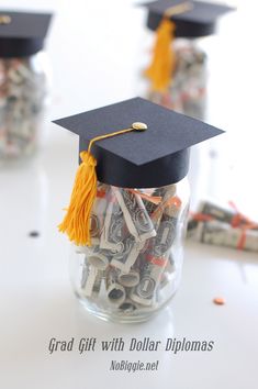 a graduation cap sitting on top of money in a jar