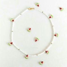 a necklace and earring set with watermelon beads