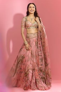 Pink lehenga with all over floral garden prints, elevated with an embroidered broad waistband using sequins, mirror. Paired with a blouse with printed base and sequin, mirror embroidery. Comes along with a dupatta with floral, sequin embroidered buttis. - Aza Fashions Wedding Choli With Floral Print And Traditional Drape, Traditional Wedding Choli With Floral Print, Wedding Floral Print Choli With Traditional Drape, Wedding Floral Print Saree Set, Pink Floral Print Lehenga With Traditional Drape, Bollywood Style Floral Print Wedding Sets, Bollywood Floral Print Wedding Lehenga, Pink Floral Print Lehenga For Wedding, Bollywood Style Wedding Choli With Floral Print