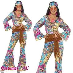 the woman is wearing colorful clothing and has her hands on her hippie's hips