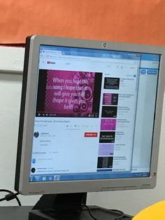 a computer monitor sitting on top of a desk