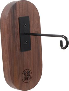 a wooden door handle with a black hook on the front and back side of it