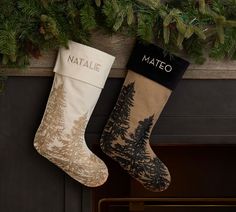 two christmas stockings hanging from a fireplace mantel with pine trees and the word mateo printed on them