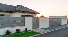 a house with two garages on the side of it