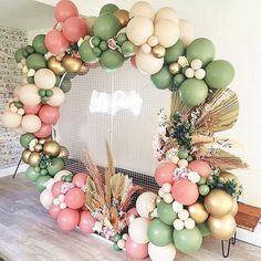 a wreath made out of balloons sitting on top of a table