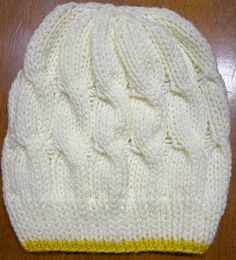 This lightweight beanie is knitted in Cable Knit  Slouchy Beanie style, that will help keep you warm during the chilly seasons. The fun cream and bright yellow colors will add a fun pop to any outfit in your wardrobe.  This beanie is knitted with love and the hope that you or whomever you gift it to will love it for years to come.  Easy care, wash on gentle and dry on low heat or allow to air dry. Part of the proceeds from this sale will go towards helping those in need in the Pacific Northwest White Knit Casual Beanie, Casual White Knit Beanie, Casual Yellow Crochet Hat Hand Knitted, Casual Yellow Handmade Crochet Hat, Casual White Knitted Bonnet, Casual Yellow Crochet Hat, Casual Yellow Crochet Cap, Cream Knitted Beanie One Size, Cream Knit Beanie One Size Fits Most