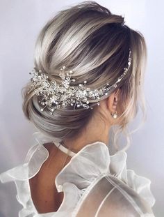 the back of a woman's head wearing a bridal hair comb