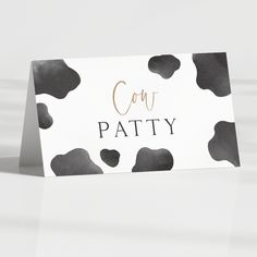 a card with black and white spots on it that says cont patty in gold lettering