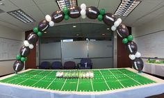 an inflatable football balloon arch on top of a table