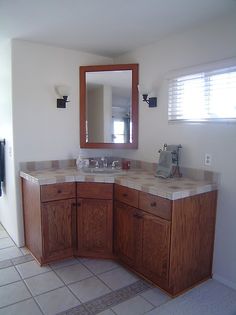 a bathroom with two sinks and a large mirror