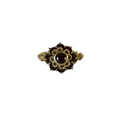 A stunning antique garnet cluster ring crafted in 14k yellow gold. This wonderful statement floral ring is set with nine deep red round cut garnet gemstones with a 1.05 ctw set in a bezel & prong setting. A wonderful addition to any antique jewelry collection. Featuring January birthstone. ERA - Circa 1930s/Art Deco Era METAL / MATERIAL - 14k yellow gold, 9 genuine garnets ( estimated 1.05 ctw) MARKINGS / HISTORY - 585 with a Star 2250AL CONDITION - Very good vintage condition. All garnets are present and in nice shape, with only very minor surface wear. Piece has been cleaned and lightly polished. Lovely antique cluster ring! SIZE / MEASUREMENTS - Size: 6 1/2, Ring head length: 11.82 mm, Back of shank: 2 mm,Weight: 2.80 grams, Victorian 14k Gold Cluster Ring For Anniversary, Victorian Ruby Ring With Center Stone, Formal Multi-stone Yellow Gold Flower Ring, Victorian Ruby Ring In Yellow Gold With Intricate Design, Victorian Yellow Gold Ruby Ring With Intricate Design, Antique Multi-stone Cluster Jewelry, Gold Rings With Rose Cut Diamonds And Garnet, Gold Garnet Ring With Rose Cut Diamonds, Ornate Yellow Gold Gemstone Rings