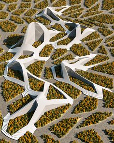 an aerial view of several white structures in the middle of a field