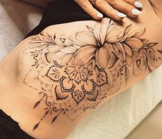 a woman's stomach with flowers on it