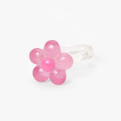 Add this cute and dainty ring to your jewelry collection! Perfect to add a pop of color, this clear resin style ring features a pretty pink flower complete with sparkly glitter. Sizes Available: 7, 8 Finish: Clear Material: Plastic - Claire's Clear Glitter Flower Resin Ring - Pink Trendy Flower Shaped Rings For Gifts, Trendy Flower Shaped Ring For Gift, Adjustable Rings For Spring Party, Spring Party Rings Adjustable, Adjustable Spring Party Rings, Adjustable Flower Ring For Party, Trendy Pink Flower Jewelry, Trendy Adjustable Flower Ring, Cute Pink Rings For Parties