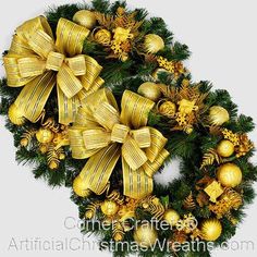 a christmas wreath with gold ornaments and bows